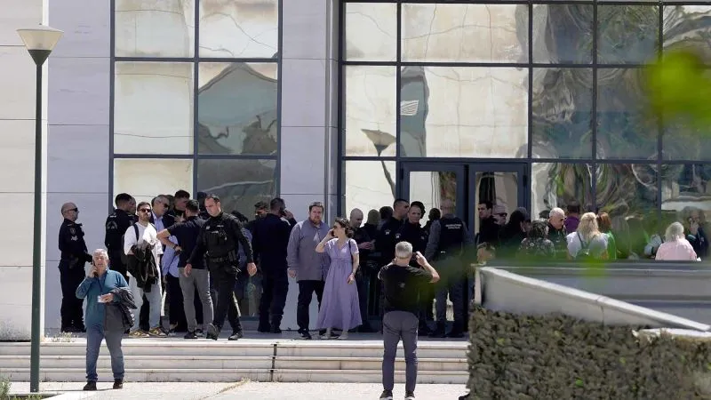 Athens shooting: Greek police hunt 89-year-old alleged gunman